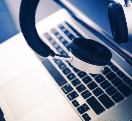 close up of laptop and headphones