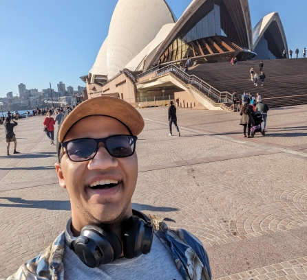 Selfie of Joshua Sweet with the famous Sydney Opera House in the background on sunny day