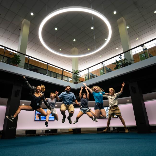 Students in Australia jumping for photo