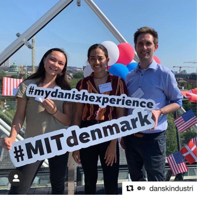 students in Denmark holding signs