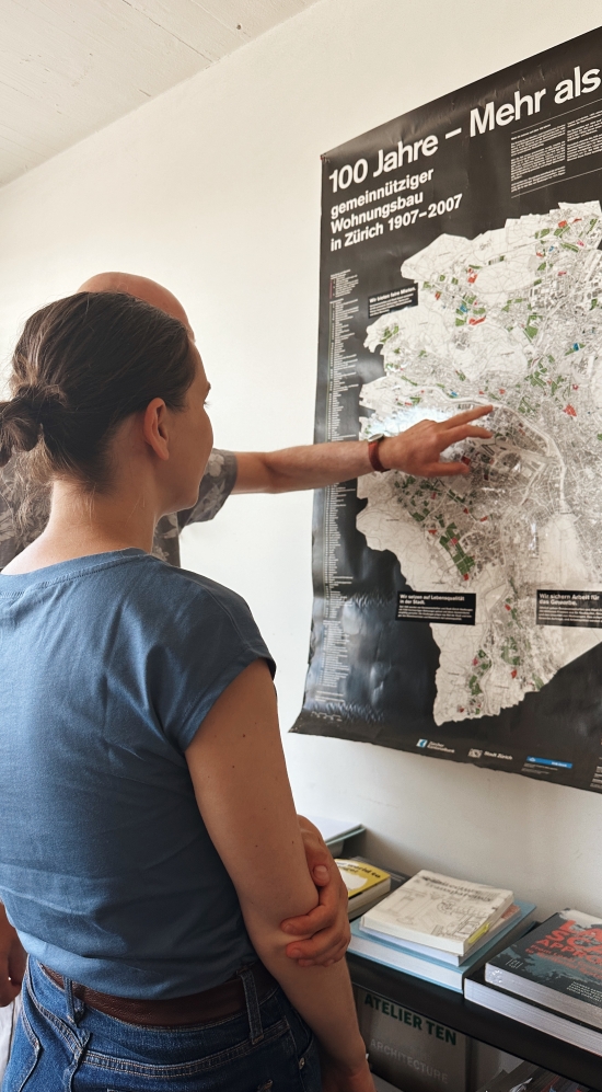 Laura-India Garinios standing in front of a map