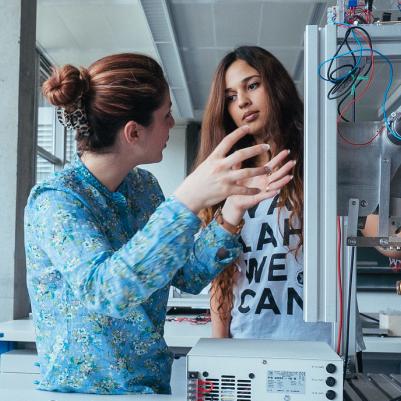 Student and host talking to each other in lab in Germany