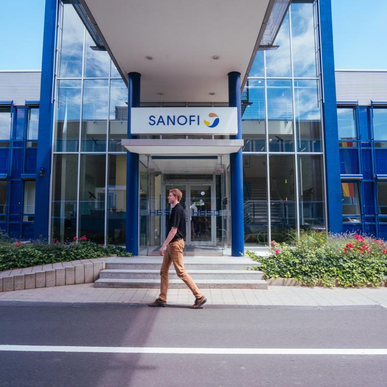 Student walking by building