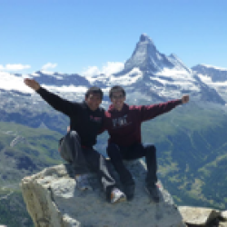 Two student interns on top of a mountain