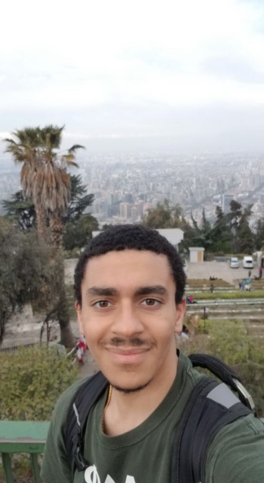 Kinan Martin selfie from the top of Cerro San Cristobal, overlooking the city of Santiago, Chile